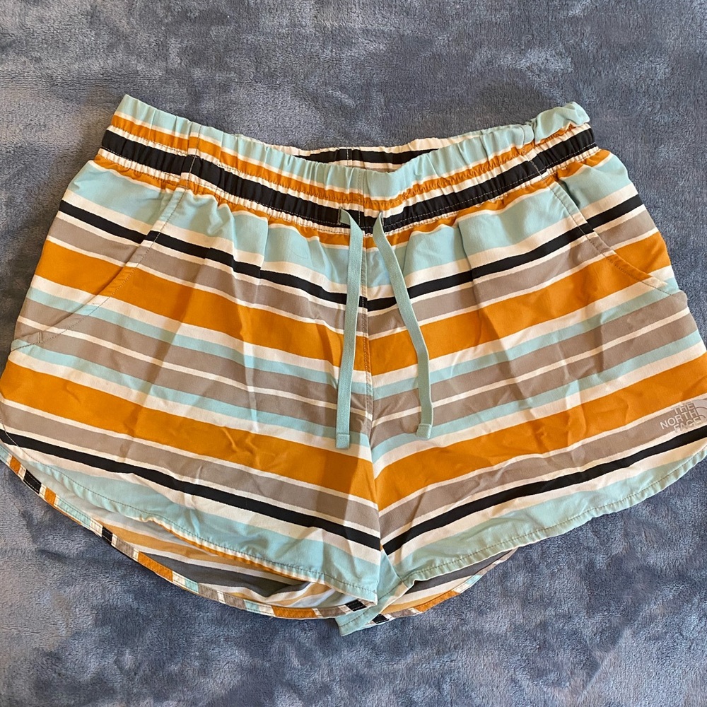 The North face shorts. Stripe and multicolored size medium with drawstring.